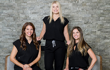 Staff members smiling together