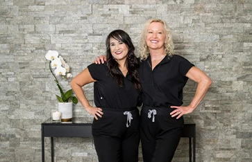 Staff members at Downtown Dental Design smiling and posing for the camera